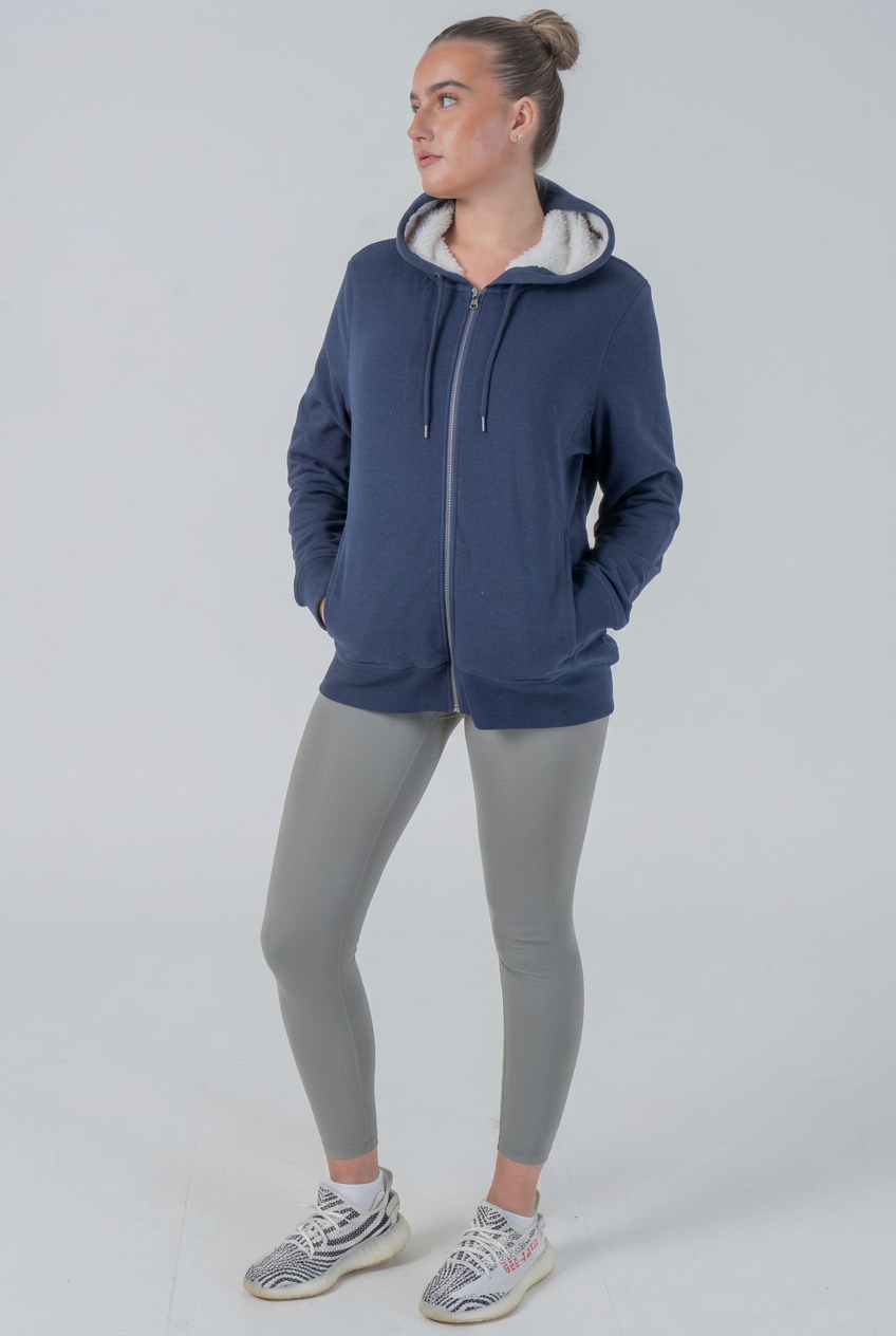 Navy sherpa hoodie on model, studio shot